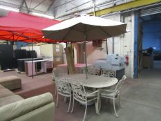 6 Seater Metal Cast outdoor dining set with seat cushions, parasol and base, the table is bent at