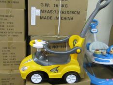 Yellow Lights and Sounds Childs Ride on car with parental handle, features removable anti fall rails