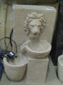 2x Outdoor lion designed water fountains, both untested and in damaged packaging.