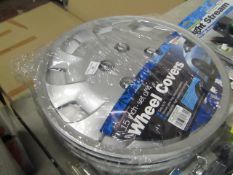 15inch Set of wheel covers, unchecked and packaged.