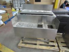 Stainless steel kitchen unit, looks to have a compartment for holding ice.