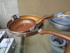 2x different pans being a bronze colour 24cm extra deep frying pan and a bronze colour 28 cm extra