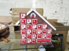 4x wooden advent calendar houses , new and boxed.