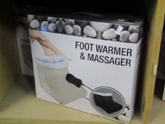 Foot warmer and massager in black, new and boxed.