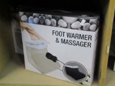 Foot warmer and massager in black, new and boxed.