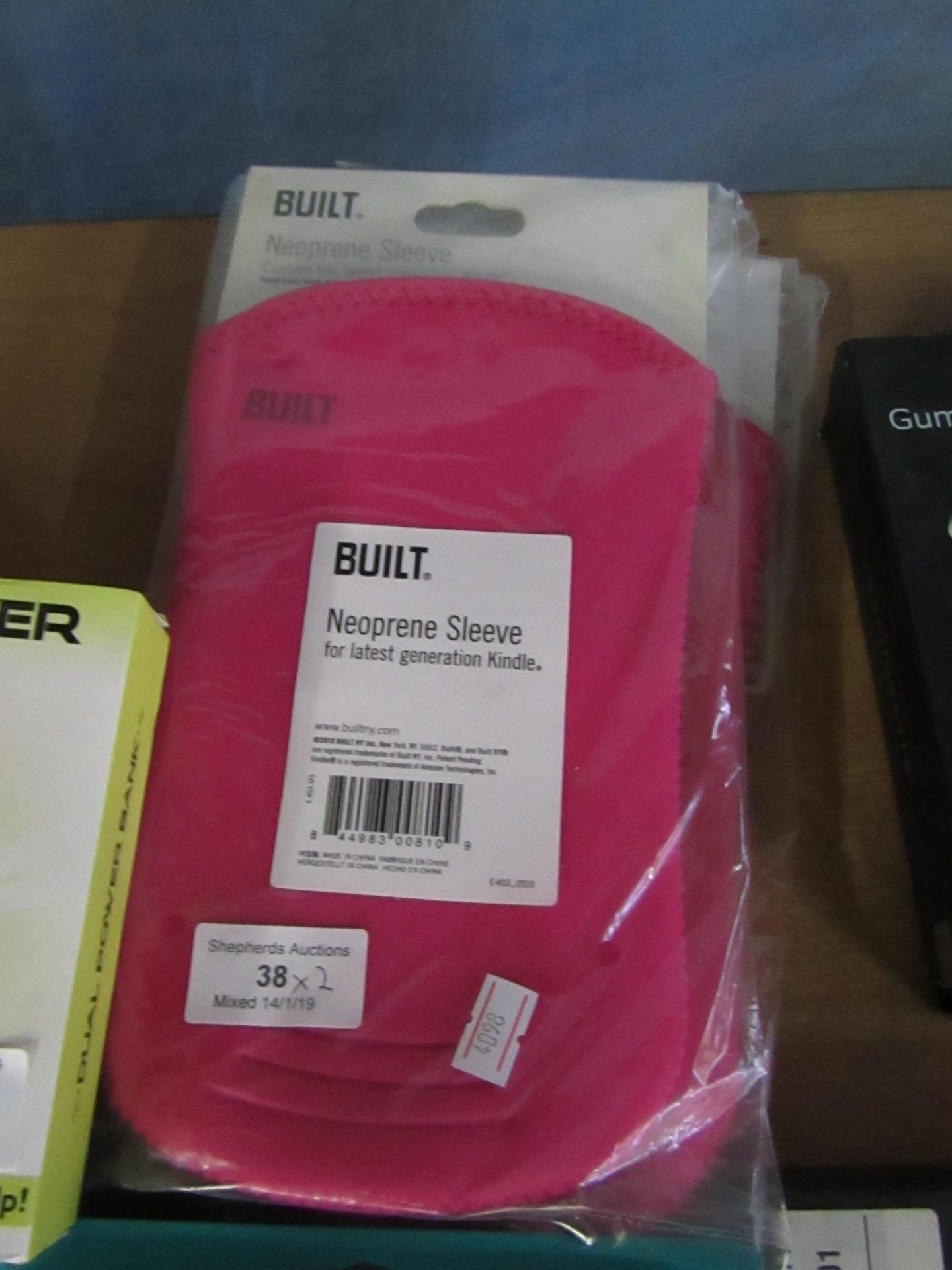 2x Built neoprene sleeve, both new and packaged.