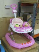 Pink coloured baby walker, new and boxed.