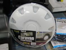 Pair of Jupiter caravan wheel covers, size 14", new and packaged.