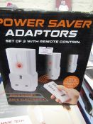 Set of 3 power saver adaptors with remote control , boxed.