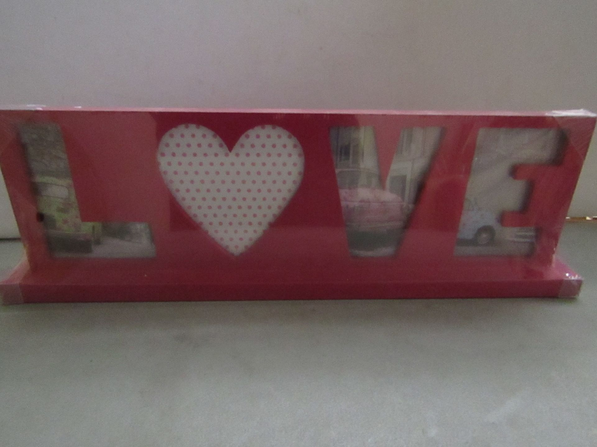 5 x love themed photo frames , new and packaged.