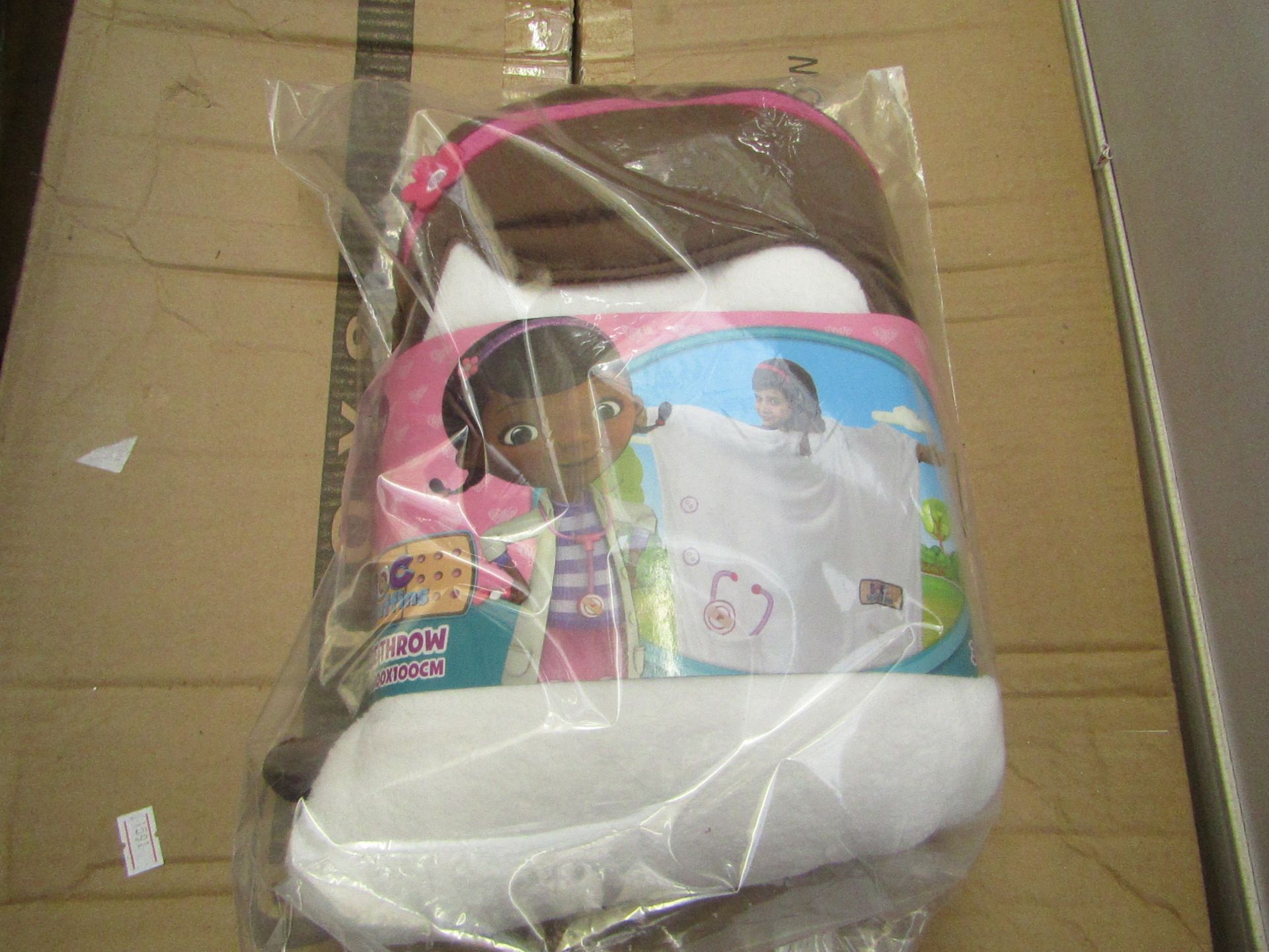Doc McStuffins hoodie throw 100x100cm, new and packaged.