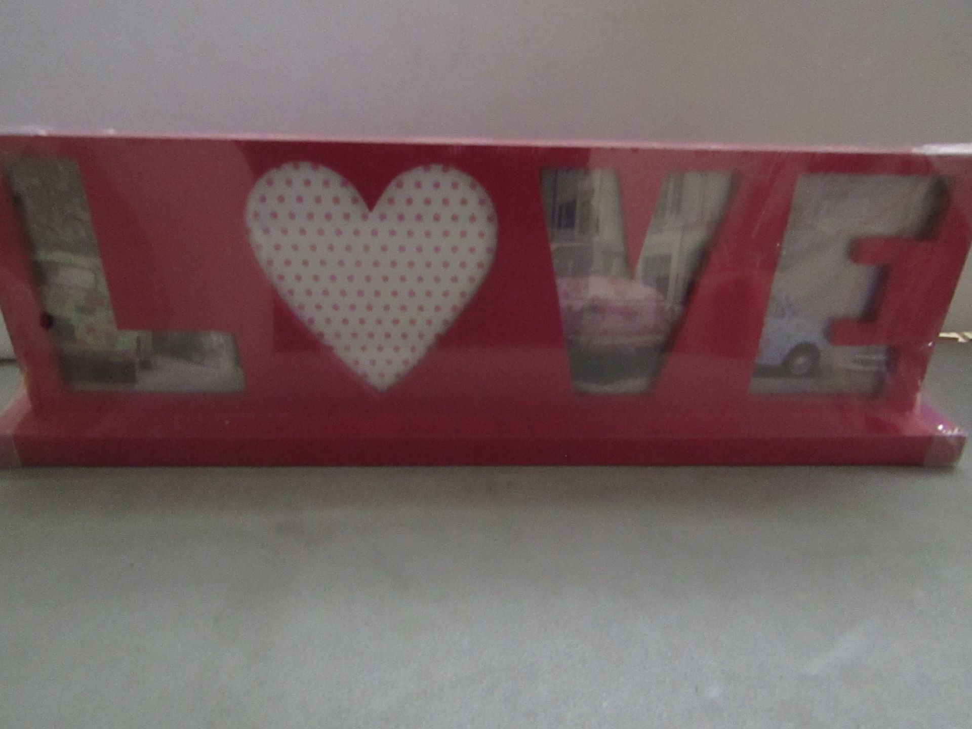 5 x love themed photo frames , new and packaged.