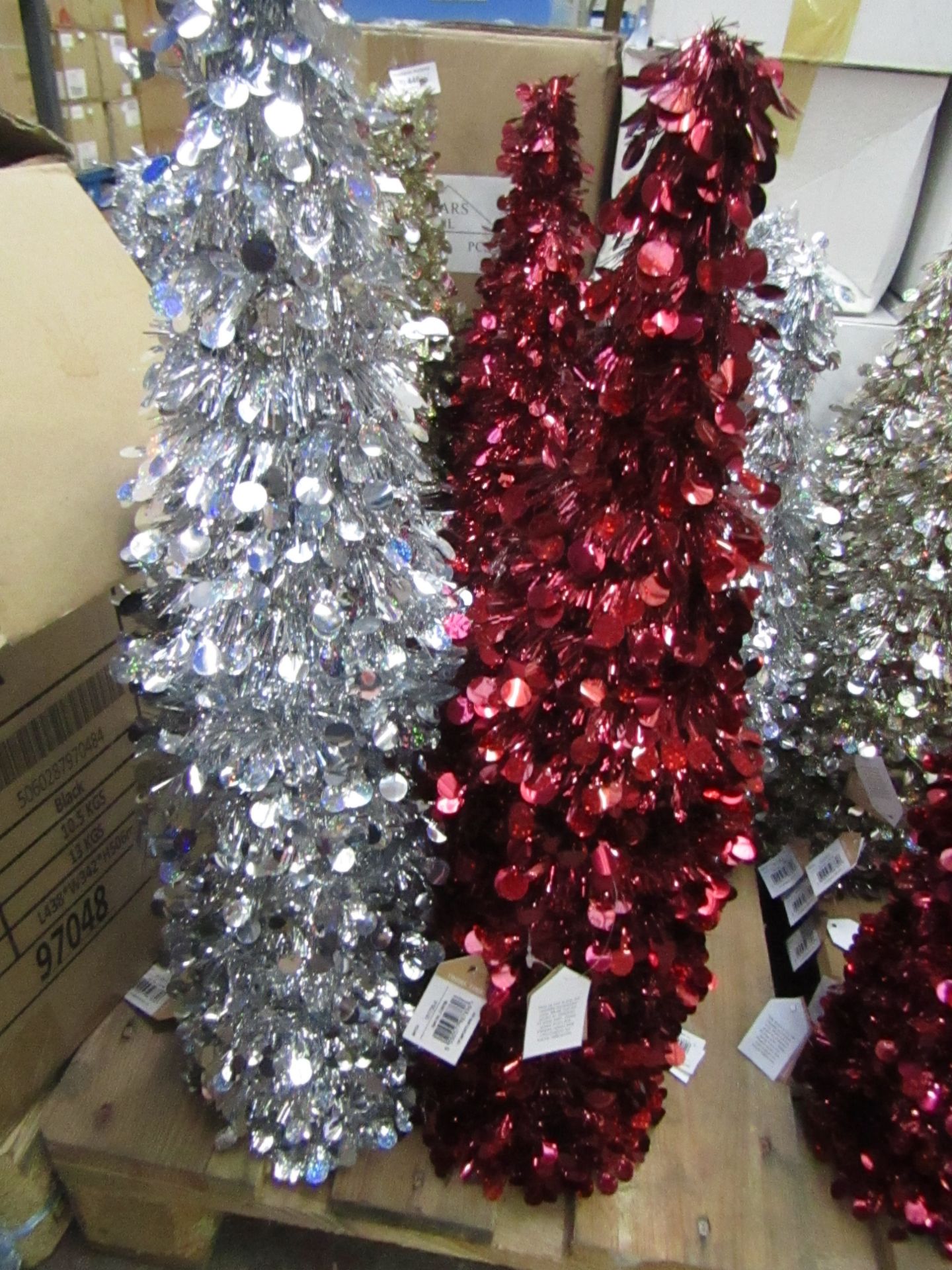 Approx 18x Tinsel trees, all new.