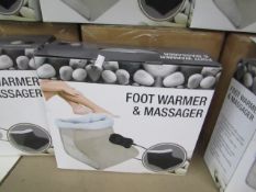 Biege Foot warmer and massager with soft fleece lining and hand held remote control, new and boxed