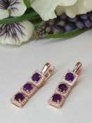 This beautiful pair of earrings is set with 6 natural Uruguayan Amethyst gemstones (IF - VVS