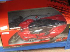 Rastar remote controlled car, untested and boxed.