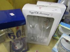 3x items being: - 50th anniversary set of 2 wine glasses - 60th anniversary set of 2 wine