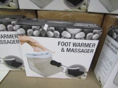 Biege Foot warmer and massager with soft fleece lining and hand held remote control, new and boxed