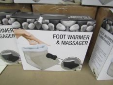 Black Foot warmer and massager with soft fleece lining and hand held remote control, new and boxed
