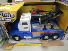 Tonka real tough towing truck toy, unchecked and in damaged packaging