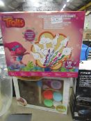 2 x items being a Trolls colour and light decoration and a chocolate maker set.