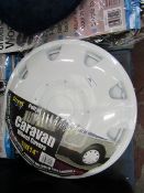 Pair of Jupiter caravan wheel covers, size 14", new and packaged.