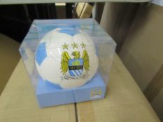 Box of approx 24x Manchester City money bank ball, new