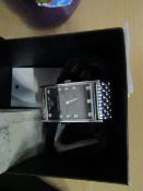 Emporio Armani wrist watch , has scratches on it , boxed.
