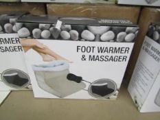 Black Foot warmer and massager with soft fleece lining and hand held remote control, new and boxed