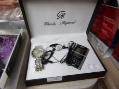 Charles and Raymond set containing, quartz watch, earphones, game radio ad key ring, all unchecked