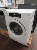 Whirlpool 6th Sense 9Kg washing machine, powers on and spins.