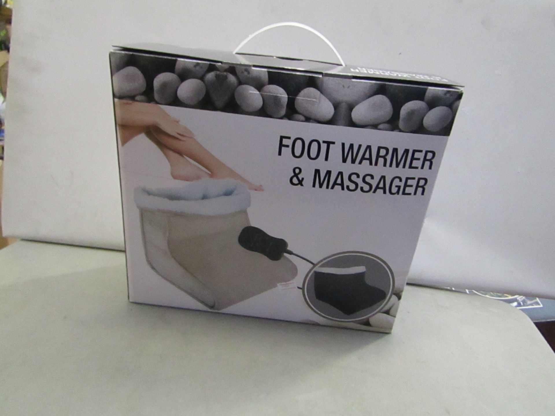 Beige foot warmer and massager , seem unused and boxed.