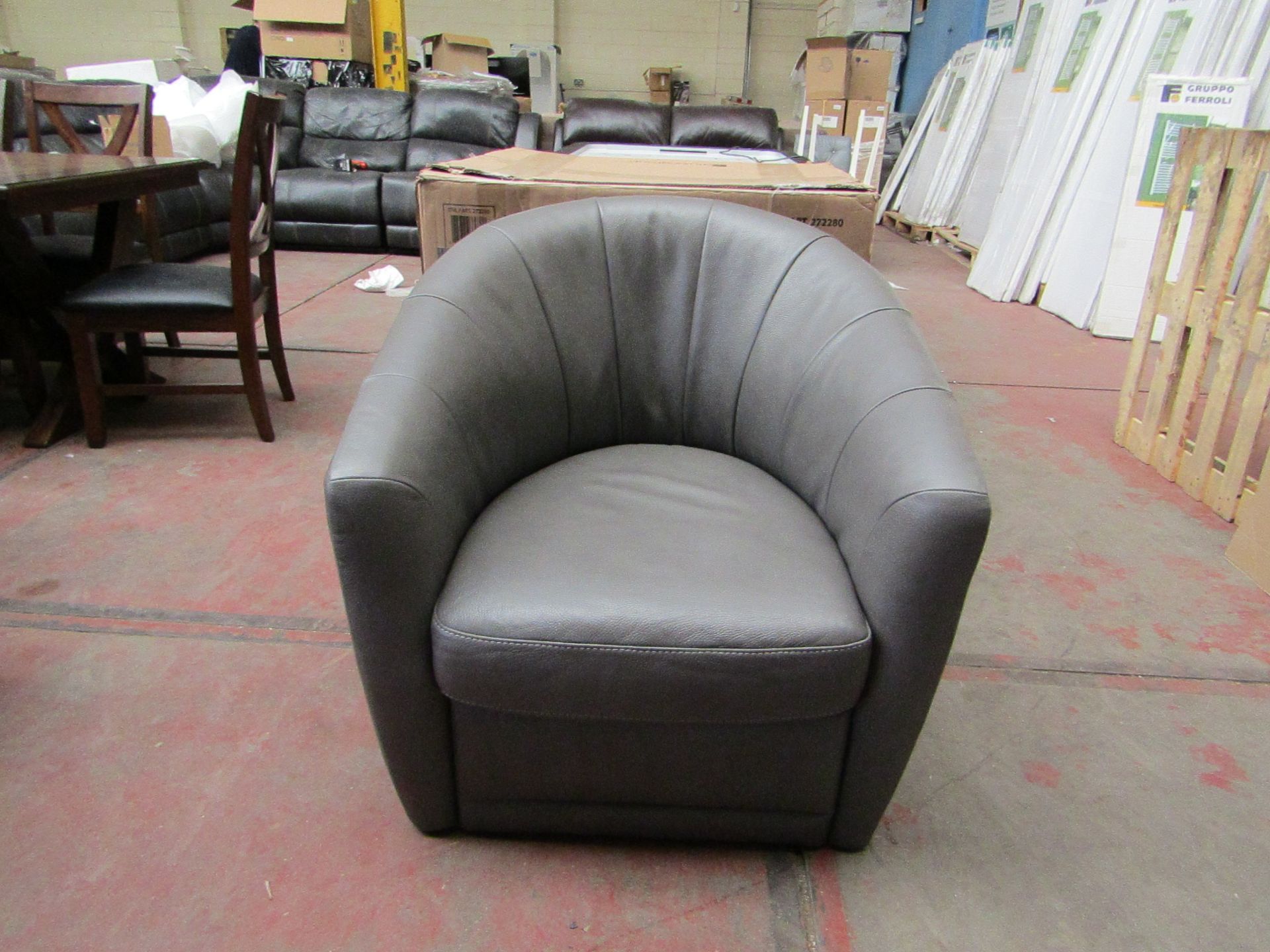 Natuzzi Grey leather Swivel armchair with original box, the chair is in good contion but the