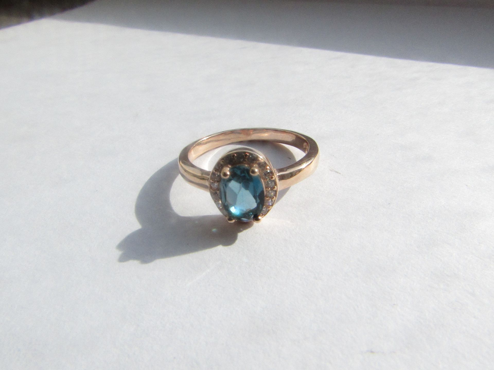 A Beautiful London Blue Topaz Ring Sterling Silver plate 14K Rose Gold. Ring Size 6,  Main Stone: