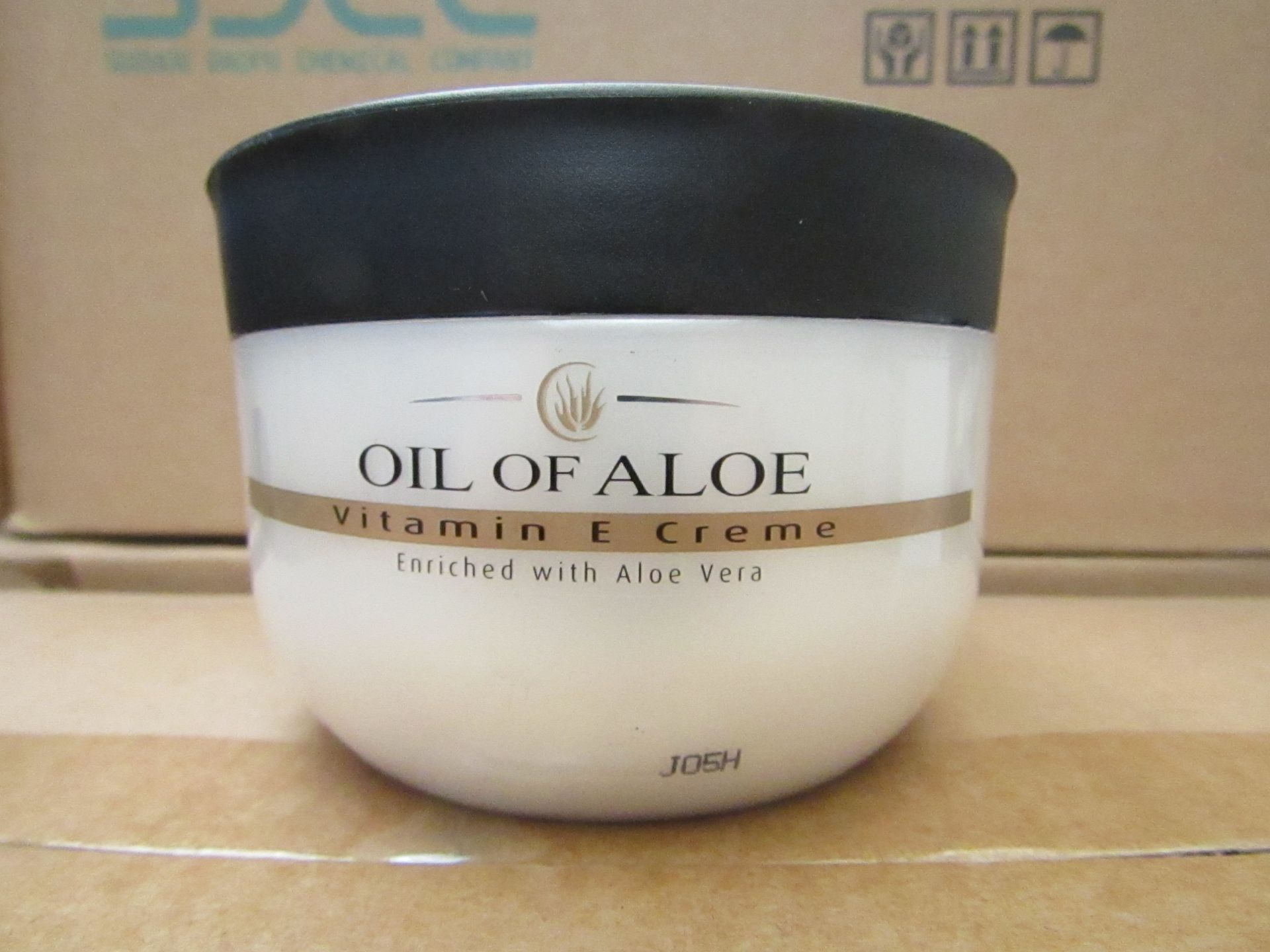 12 x 300ml Oil Of Aloe vitamin E cream, unused and boxed.