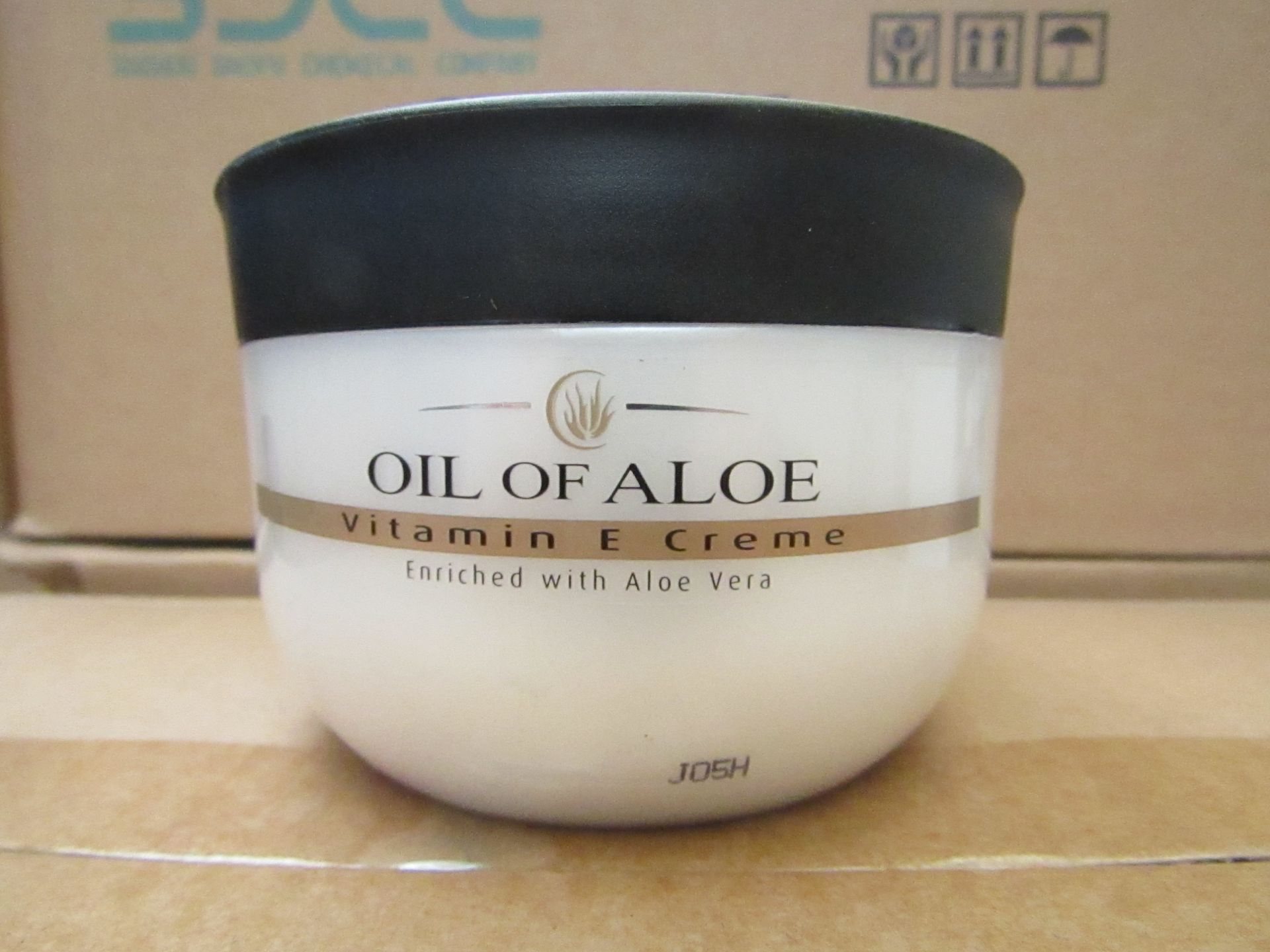 12 x 300ml Oil Of Aloe vitamin E cream, unused and boxed.