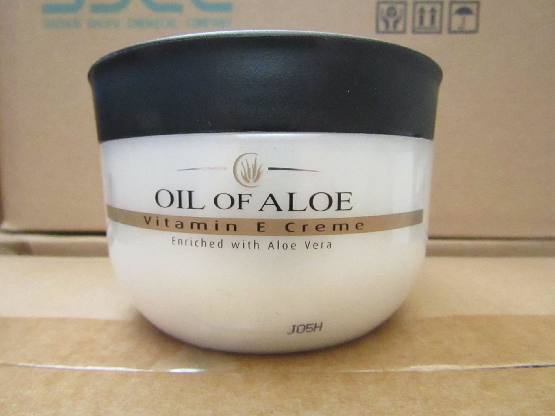 12 x 300ml Oil Of Aloe vitamin E cream, unused and boxed.