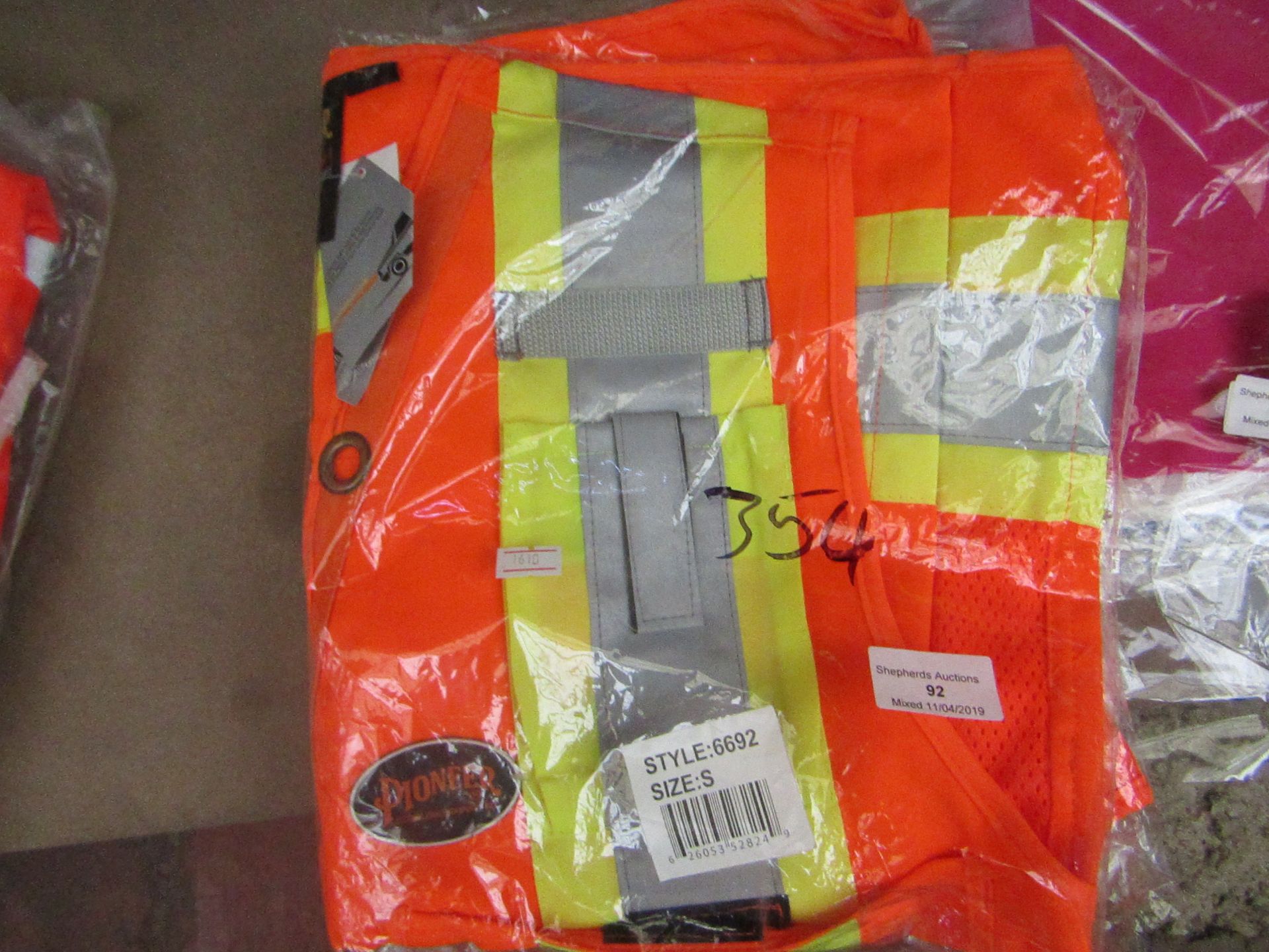 Pioneer orange waistcoat, size S, new and packaged.