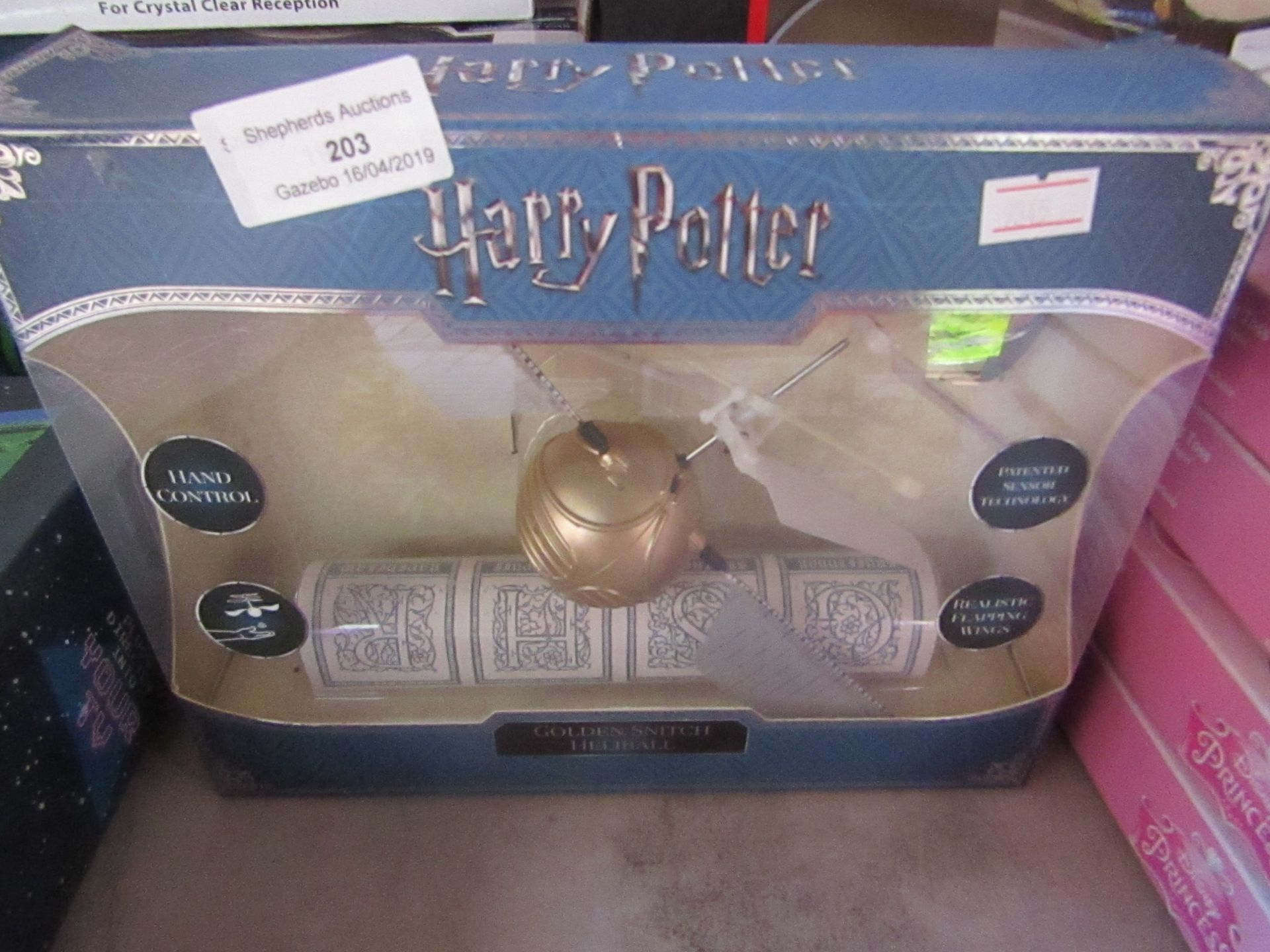 Harry Potter Golden Snitch flying item, boxed and unchecked