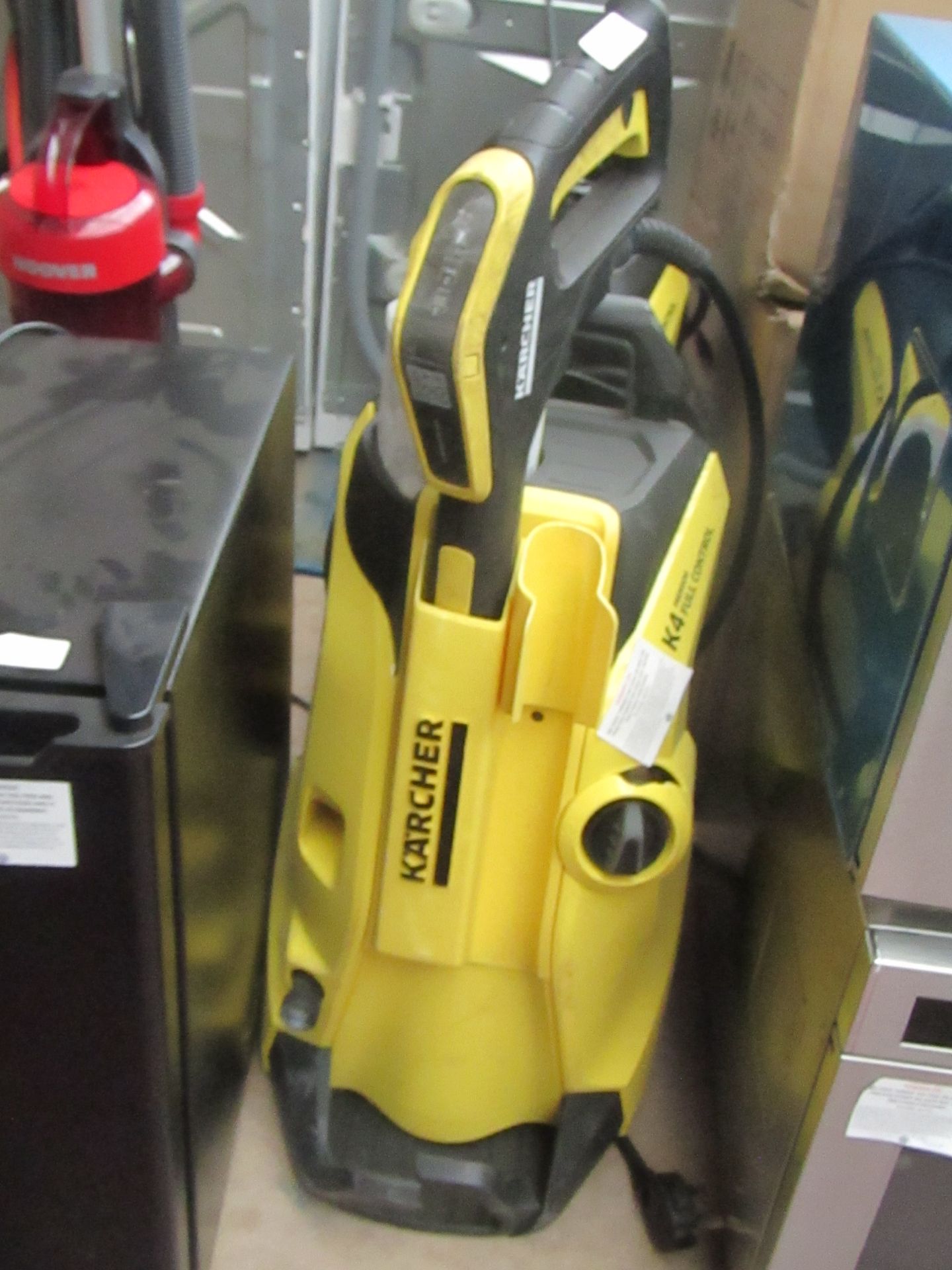Karcher K4 Full Control Premium pressure washer, powers on. Accessories included: Soap extension