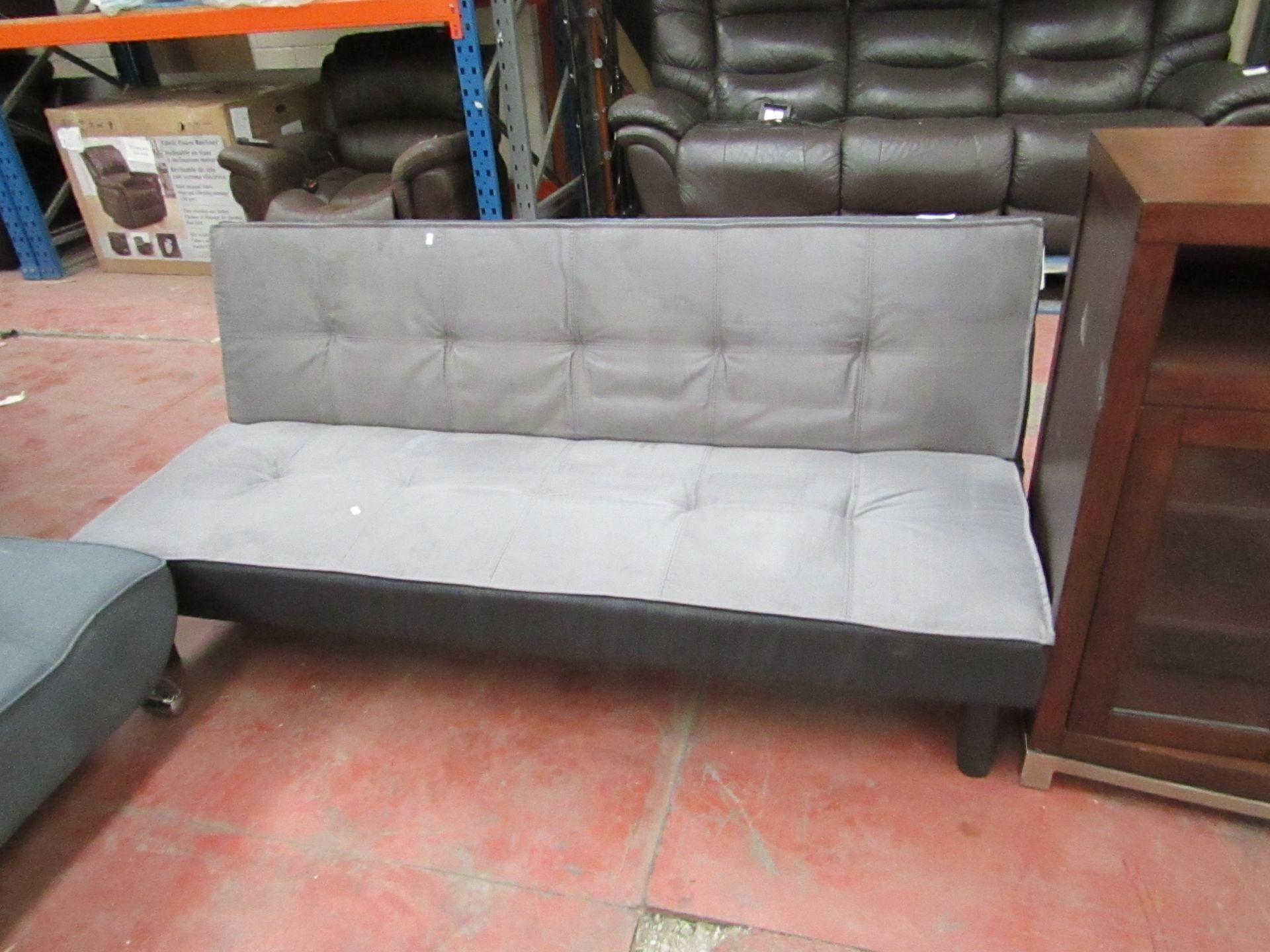 Grey Sofa bed with drop down back.