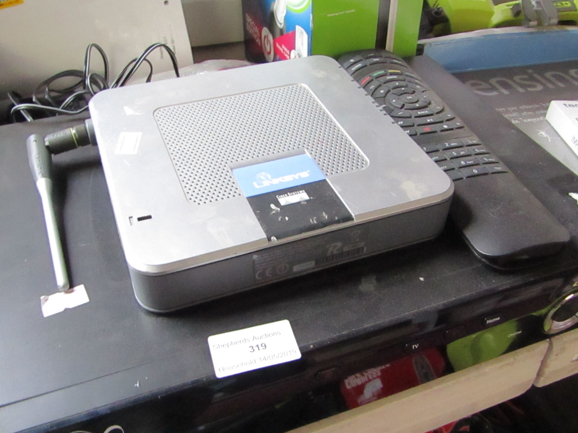 Virgin V+ box with remote untested and linksy wireless router untested.