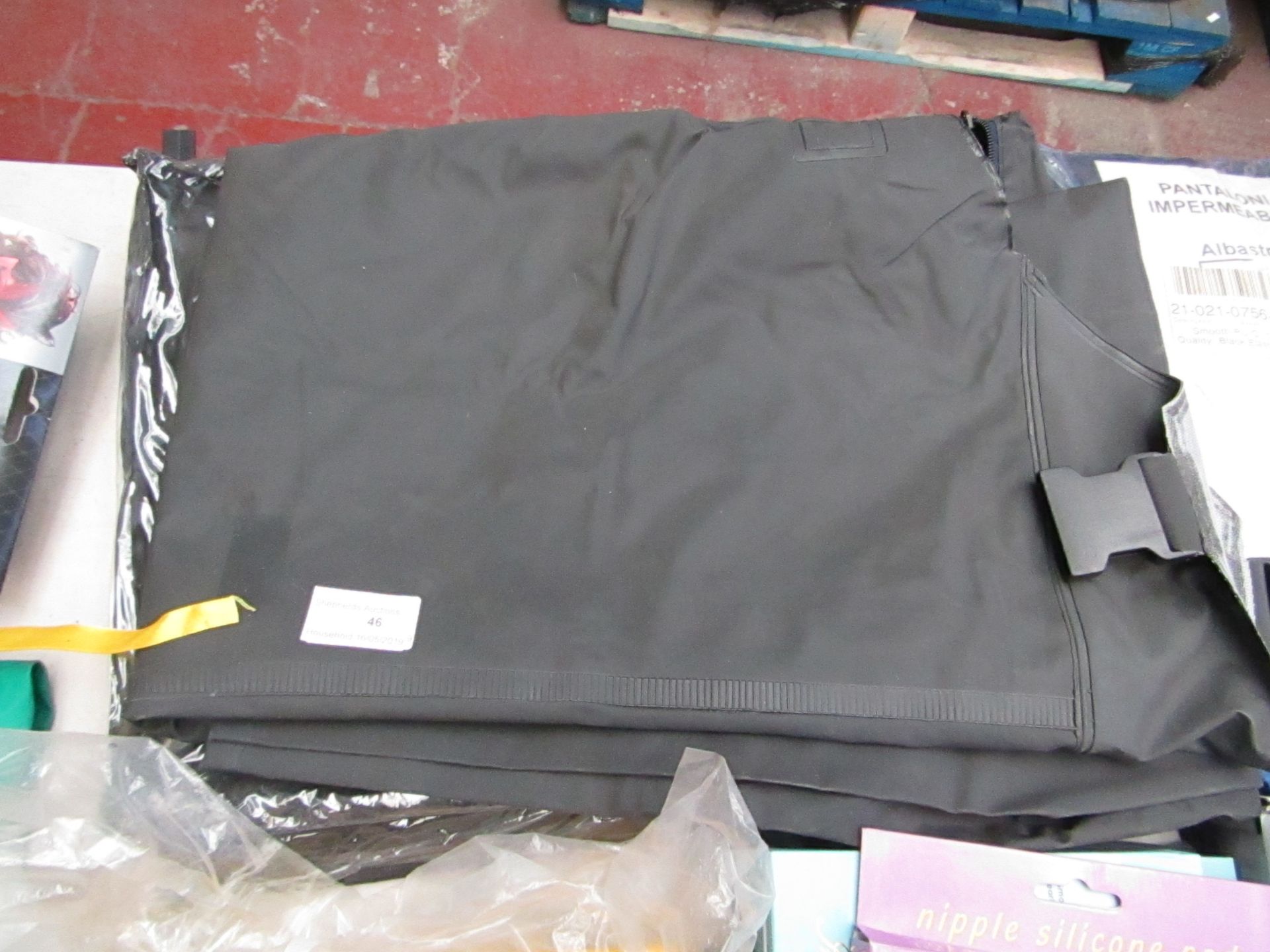 Black over clothes bib and brace, size M/L, new and packaged.