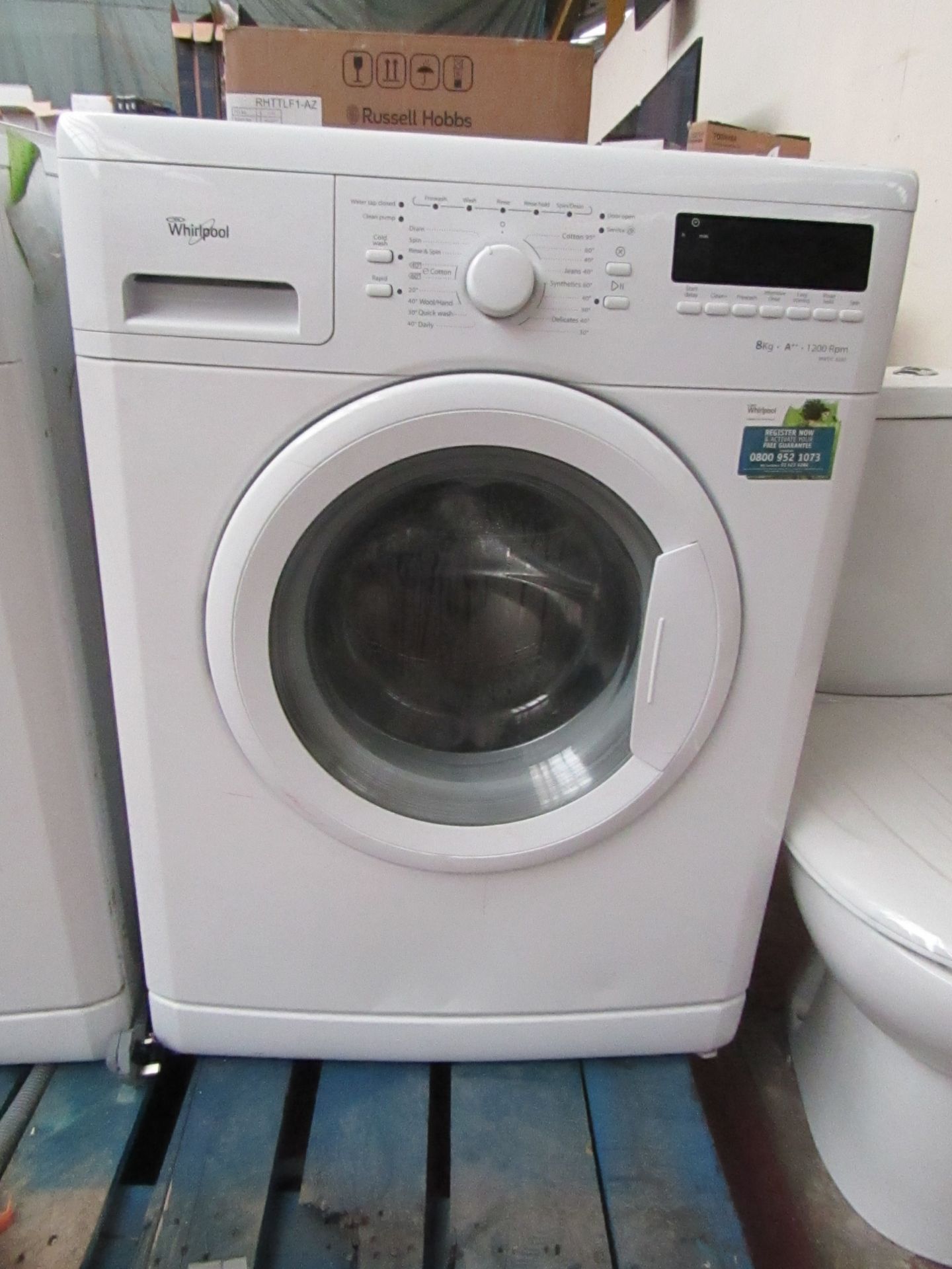 Whirlpool 6th sense 8Kg washing machine, powers on and spins.