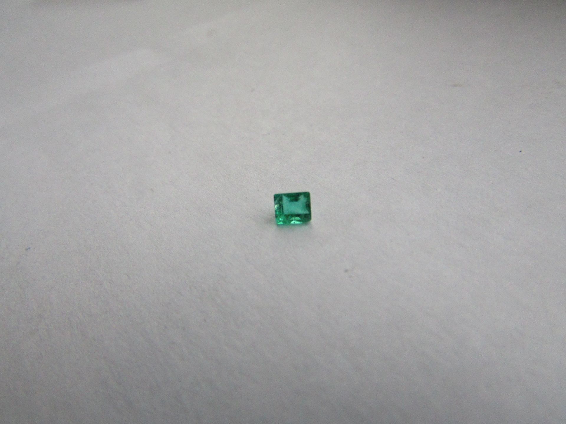 Natural Emerald Weight 0.20 Carat Colour: 100- medium Dark Very Slightly Bluish Green; Strong