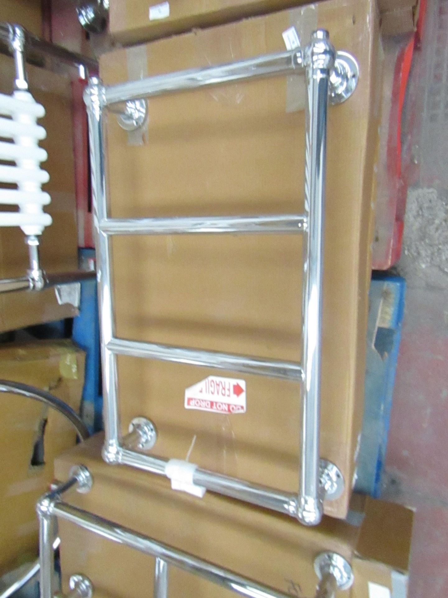 Chrome Astor wall mounter radiator, unchecked and boxed 72 x 44 x 14cm