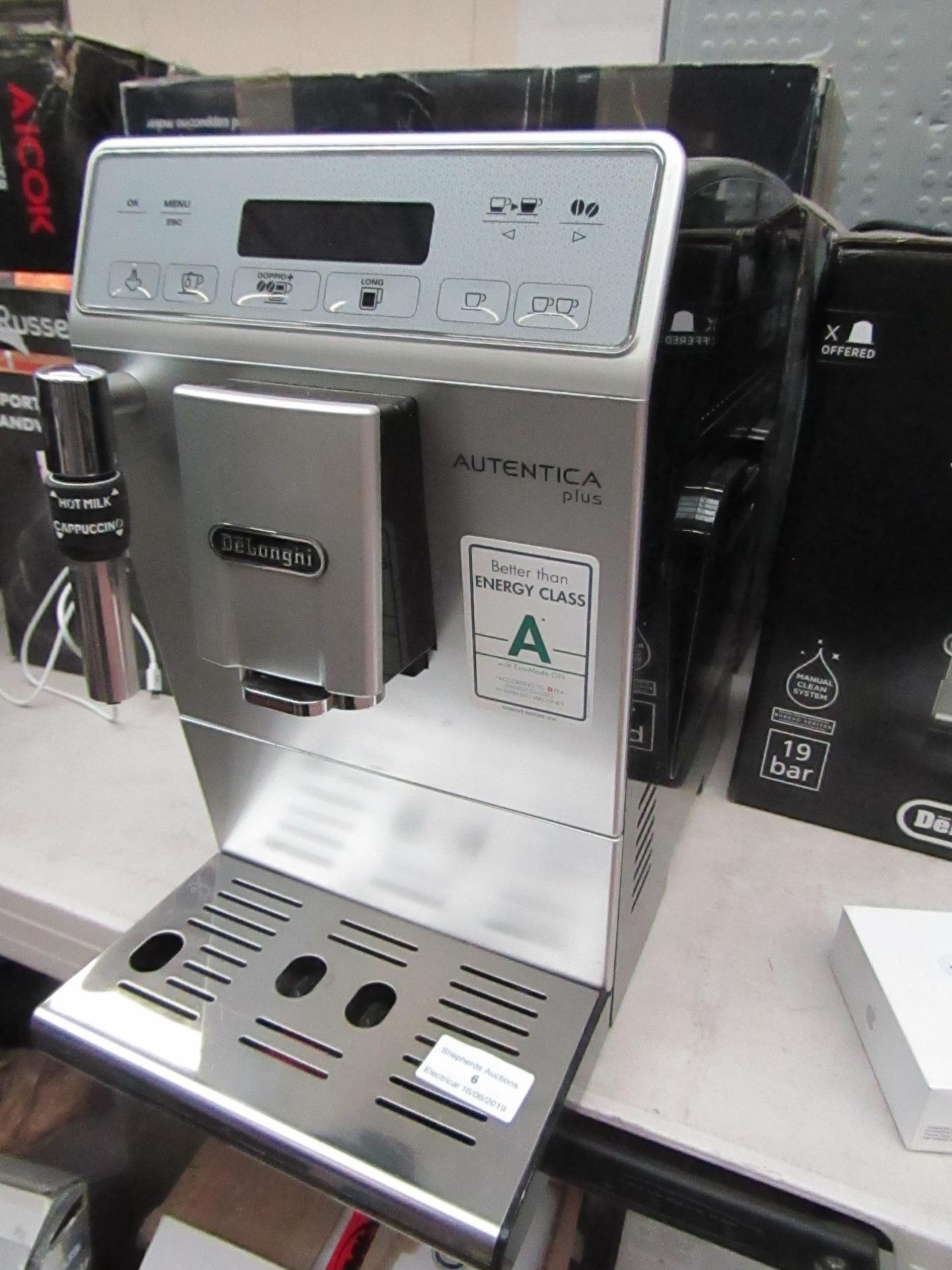 DeLonghi Autentica Plus coffee machine, powers on and boxed. RRP £399.98