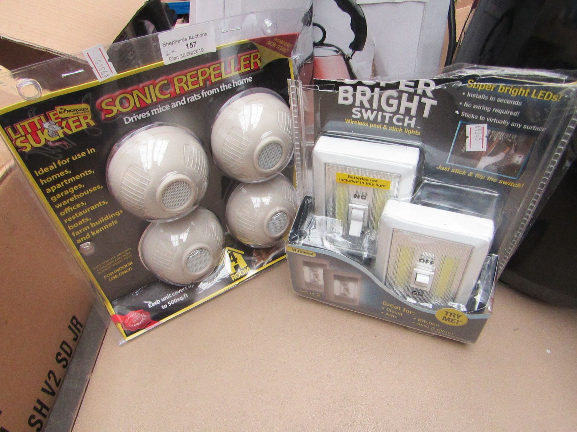 2 x items being, 1 rodent repeller and 1 x 2 pack of super bright led light switches, boxed and