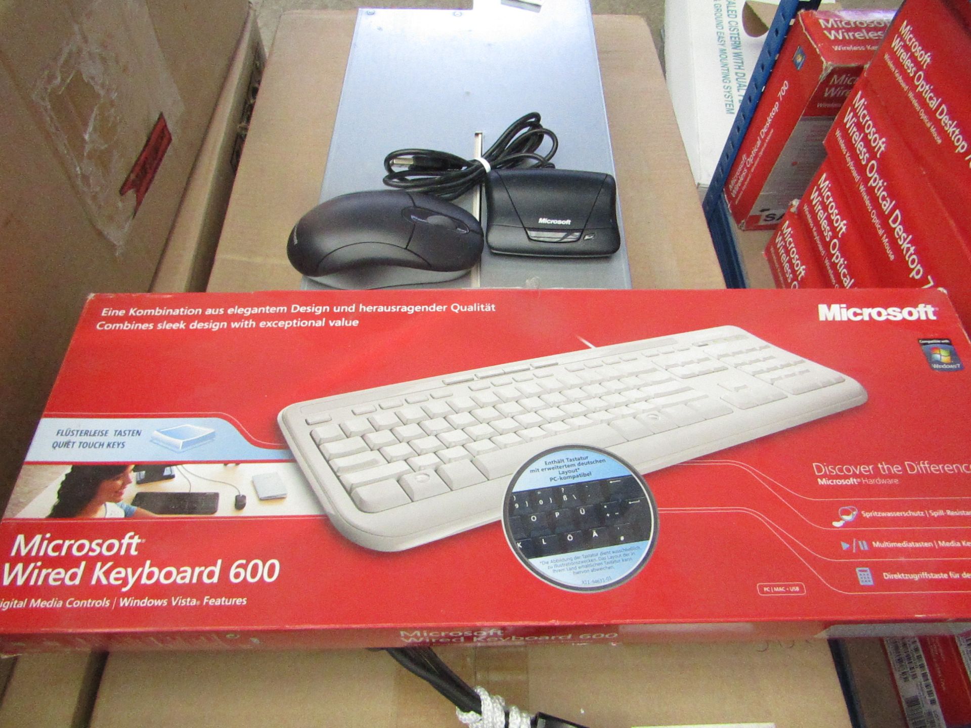 Microsoft wired keyboard with a Microsoft wireless mouse, tested working and boxed.