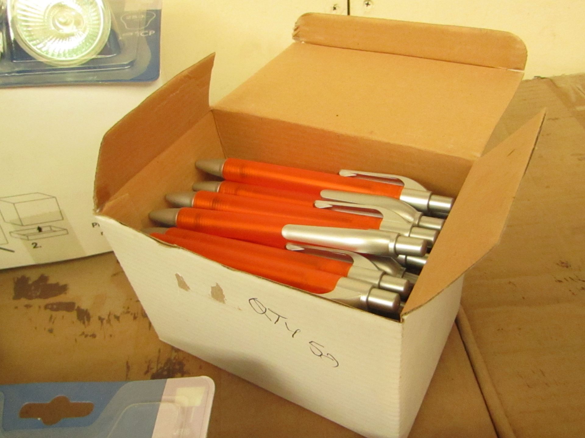 2 boxes of 50 orange pens (black ink) new in box